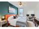 Stylish bedroom with a modern color palette, featuring a dedicated workspace and a decorative ceiling fan at 85 Uinta Way # 702, Denver, CO 80230