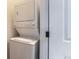 Efficient laundry area featuring a stacked washer and dryer set for space-saving convenience at 85 Uinta Way # 702, Denver, CO 80230