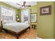 Tranquil bedroom bathed in natural light, featuring hardwood floors and a soothing green color scheme at 1301 N Ogden St # 1A, Denver, CO 80218