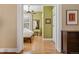 Sunlit bedroom featuring hardwood floors, neutral walls and a ceiling fan at 1301 N Ogden St # 1A, Denver, CO 80218