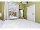 Comfortable bedroom featuring a sun-filled window with white curtains at 1301 N Ogden St # 1A, Denver, CO 80218