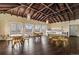 Spacious common room with wood floors, high ceilings, and multiple seating areas offering ample natural light at 1301 N Ogden St # 1A, Denver, CO 80218