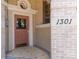 Charming entryway featuring colorful tile, with an exterior door adorned with classic architectural trim at 1301 N Ogden St # 1A, Denver, CO 80218