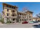 Elegant multi-story building showcasing classic architectural design with balconies and ample parking on a sunny day at 1301 N Ogden St # 1A, Denver, CO 80218