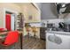 Well-lit kitchen boasts updated appliances, a gas range, and a breakfast bar adjacent to the dining area at 1301 N Ogden St # 1A, Denver, CO 80218