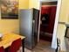 Bright kitchen features stainless steel refrigerator and eat in dining at 1301 N Ogden St # 1A, Denver, CO 80218