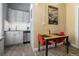 Cozy kitchen nook with updated stainless appliances and wood-look tile flooring at 1301 N Ogden St # 1A, Denver, CO 80218