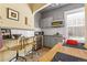 Efficient kitchen with gray cabinetry, stainless steel appliances, and a cozy breakfast nook next to the window at 1301 N Ogden St # 1A, Denver, CO 80218