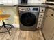 Modern washer and dryer featuring a front-loading design and stainless steel finish at 1301 N Ogden St # 1A, Denver, CO 80218