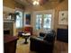 Comfortable living room boasts hardwood floors, fireplace, and French doors with ironwork at 1301 N Ogden St # 1A, Denver, CO 80218