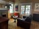 Inviting living room features a cozy fireplace, and French doors with decorative ironwork at 1301 N Ogden St # 1A, Denver, CO 80218