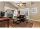 Comfortable living room showcasing a fireplace, hardwood floors, and abundant natural light, plus space for entertaining at 1301 N Ogden St # 1A, Denver, CO 80218
