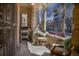 Inviting porch with chairs and a grill, providing a cozy outdoor space to relax and entertain at 1301 N Ogden St # 1A, Denver, CO 80218