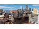 Rooftop patio with outdoor seating and stunning city skyline view at 1301 N Ogden St # 1A, Denver, CO 80218