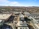 Scenic aerial view showcasing a large shopping center area and vast parking lots with mountain views at 7240 W Custer Ave # 119, Lakewood, CO 80226