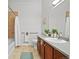 Bathroom featuring a vanity, a toilet, and a shower-tub combo at 7240 W Custer Ave # 119, Lakewood, CO 80226
