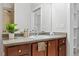 Bathroom featuring a dark vanity and a plant at 7240 W Custer Ave # 119, Lakewood, CO 80226