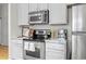 Bright kitchen with stainless steel appliances and light countertops at 7240 W Custer Ave # 119, Lakewood, CO 80226