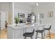 Modern kitchen with stainless steel appliances, marble countertops, and island with seating at 7240 W Custer Ave # 119, Lakewood, CO 80226