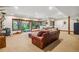 Basement Gathering room featuring a fireplace, sliding glass doors to the outside and ample seating at 14271 Timber Trl, Larkspur, CO 80118