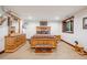 Bedroom featuring wood furniture, wooden window trim, and natural light at 14271 Timber Trl, Larkspur, CO 80118