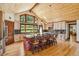 Gourmet kitchen with wooden cabinets, granite countertops, a large island, and windows with picturesque views at 14271 Timber Trl, Larkspur, CO 80118