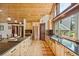 Updated kitchen features sleek countertops, stainless steel appliances, and ample storage in light wood cabinetry at 14271 Timber Trl, Larkspur, CO 80118