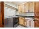 Laundry room with stainless steel washer and dryer, cabinets, and countertop space at 14271 Timber Trl, Larkspur, CO 80118