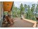 Relax on the deck with amazing forest views at 14271 Timber Trl, Larkspur, CO 80118
