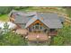 An expansive rear deck offers ample outdoor seating at 14271 Timber Trl, Larkspur, CO 80118