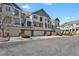 Exterior showcasing attached garages and attractive facade with brick and neutral siding at 1443 S Emporia Ct, Aurora, CO 80247