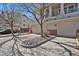 View of a townhouse with individual garages and a meticulously landscaped front at 1443 S Emporia Ct, Aurora, CO 80247