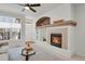 Comfortable living room showcasing a fireplace, neutral tones, and elegant decor at 1443 S Emporia Ct, Aurora, CO 80247