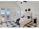 Bright and airy bedroom with vaulted ceilings, a ceiling fan and private balcony at 1443 S Emporia Ct, Aurora, CO 80247