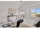 Bright bedroom featuring a vaulted ceiling and private balcony at 1443 S Emporia Ct, Aurora, CO 80247