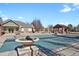 Community pool area featuring a pool house, decorative urns, and pergola at 1443 S Emporia Ct, Aurora, CO 80247