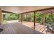 Spacious wooden deck with a pergola, perfect for outdoor entertaining and relaxing in a private backyard setting at 8292 E Lehigh Dr, Denver, CO 80237