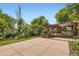 Large backyard featuring a patio, pergola covered deck, grassy area, mature trees, and landscaping for outdoor enjoyment at 8292 E Lehigh Dr, Denver, CO 80237
