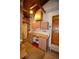 Basement workspace with cabinets, countertop, and easy access to the outside at 8292 E Lehigh Dr, Denver, CO 80237