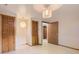 Spacious basement room featuring two closets and a doorway at 8292 E Lehigh Dr, Denver, CO 80237