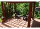 Inviting deck with dark brown wood and two chairs surrounding a small table at 8292 E Lehigh Dr, Denver, CO 80237