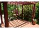 Charming deck with a wood frame, lush greenery and climbing roses at 8292 E Lehigh Dr, Denver, CO 80237