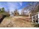 Expansive backyard with a wooden deck and storage shed, ideal for outdoor activities at 1777 Spruce St, Denver, CO 80220