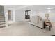 Finished basement with plush carpet, comfortable seating, and a modern laundry area at 1777 Spruce St, Denver, CO 80220