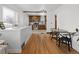 Open dining area with wood floors connects seamlessly to the kitchen with stainless steel appliances at 1777 Spruce St, Denver, CO 80220