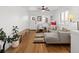 Inviting living room with natural light, a comfortable couch, and stylish décor at 1777 Spruce St, Denver, CO 80220