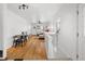 Open-concept living room featuring hardwood floors and neutral decor at 1777 Spruce St, Denver, CO 80220