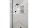 Sleek, modern shower with white subway tile and a glass partition, providing a clean aesthetic at 1777 Spruce St, Denver, CO 80220