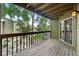 Cozy wooden balcony with a view of the surrounding greenery and neighboring buildings at 2960 Shadow Creek Dr # 201, Boulder, CO 80303