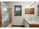 Bathroom featuring a shower and single vanity and window at 2960 Shadow Creek Dr # 201, Boulder, CO 80303